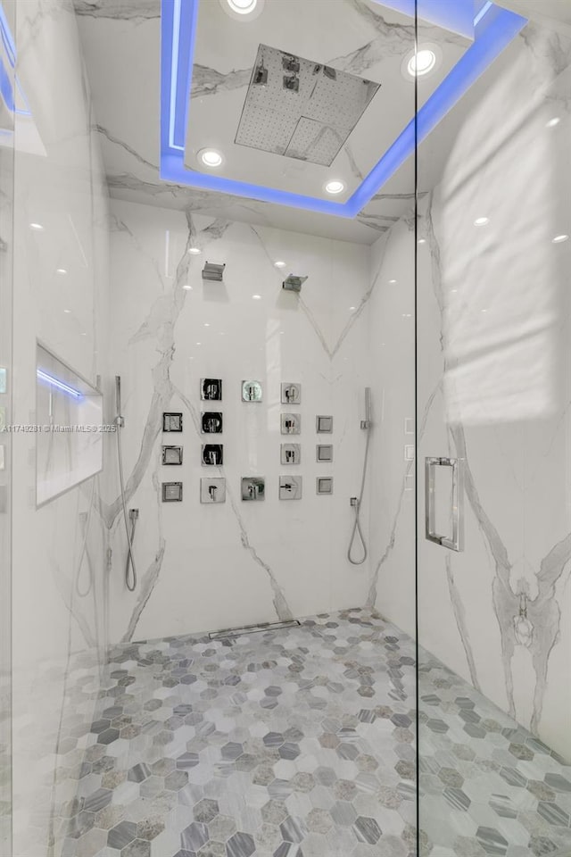 bathroom with a marble finish shower