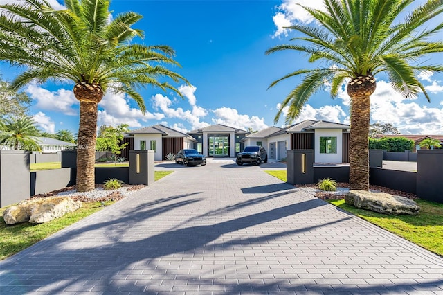 view of road featuring a residential view and decorative driveway