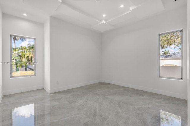 unfurnished room featuring recessed lighting, baseboards, and a wealth of natural light