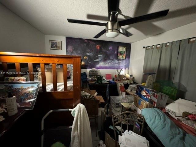 interior space featuring ceiling fan and a textured ceiling