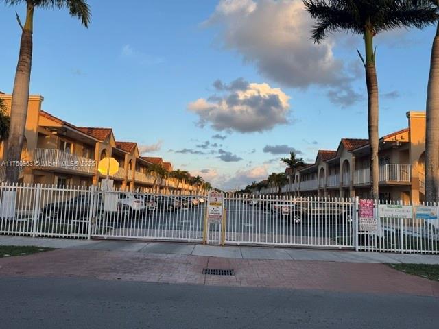 view of gate with fence