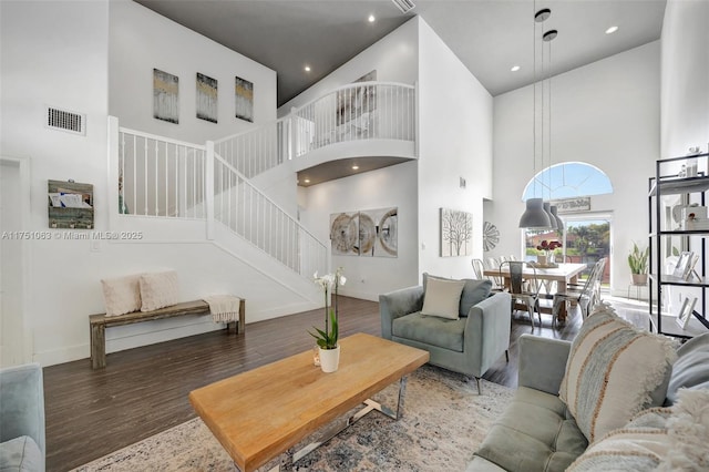 kitchen with visible vents, baseboards, light wood-style flooring, stainless steel appliances, and white cabinetry