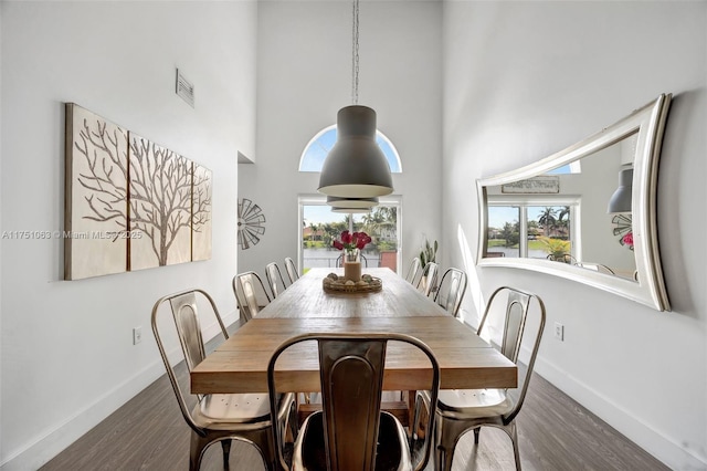 kitchen featuring stainless steel appliances, a sink, white cabinets, and a healthy amount of sunlight