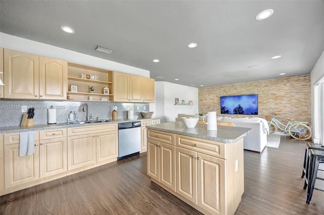 kitchen with dishwasher, a sink, light brown cabinets, and dark wood-style floors