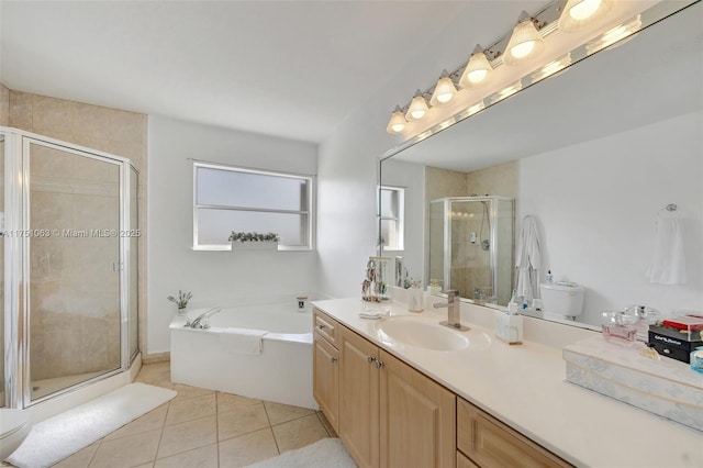 full bathroom featuring tile patterned flooring, vanity, a bath, and a shower stall