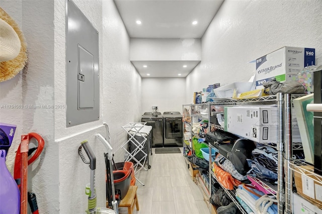 interior space with electric panel and independent washer and dryer