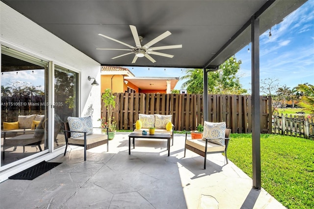 view of patio with ceiling fan, an outdoor hangout area, and fence