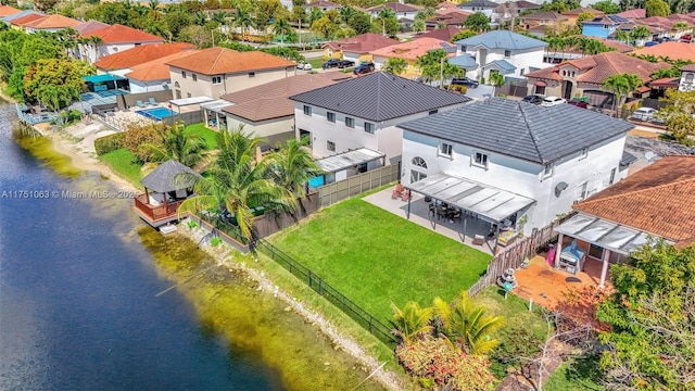 bird's eye view with a water view and a residential view