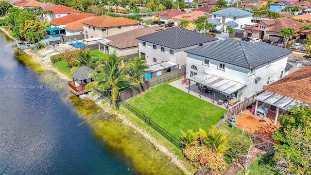 aerial view with a water view and a residential view