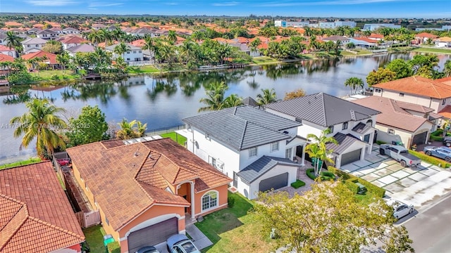 aerial view featuring a water view and a residential view