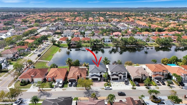 aerial view with a residential view and a water view