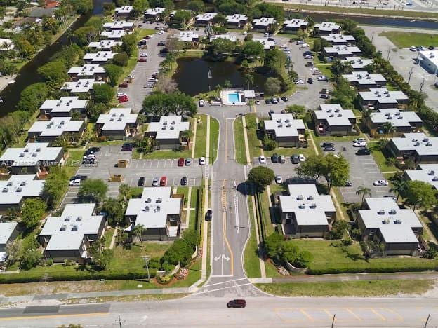 birds eye view of property with a residential view