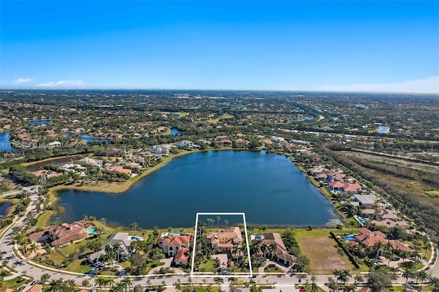 aerial view with a residential view and a water view