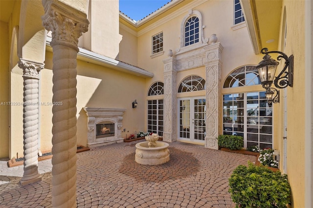 view of patio / terrace with a premium fireplace