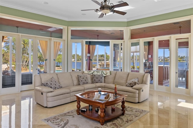 living area with ornamental molding, marble finish floor, french doors, and a ceiling fan