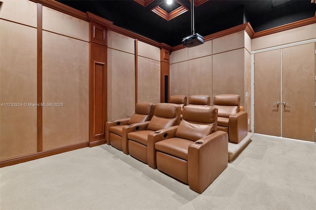 home theater with crown molding, a decorative wall, and light colored carpet