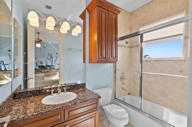 full bath featuring toilet, visible vents, combined bath / shower with glass door, and vanity