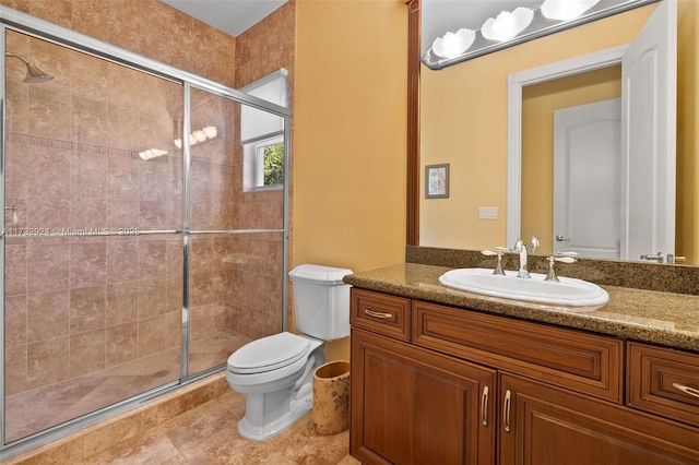 full bath with tile patterned flooring, vanity, toilet, and a shower stall