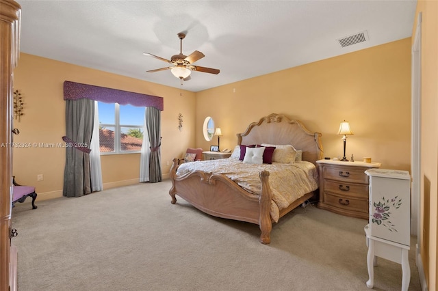 bedroom with baseboards, visible vents, a ceiling fan, and light colored carpet