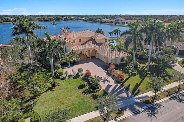 birds eye view of property with a water view