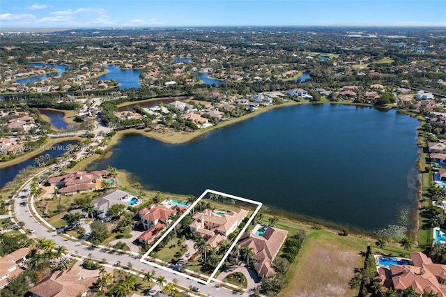 birds eye view of property featuring a water view and a residential view