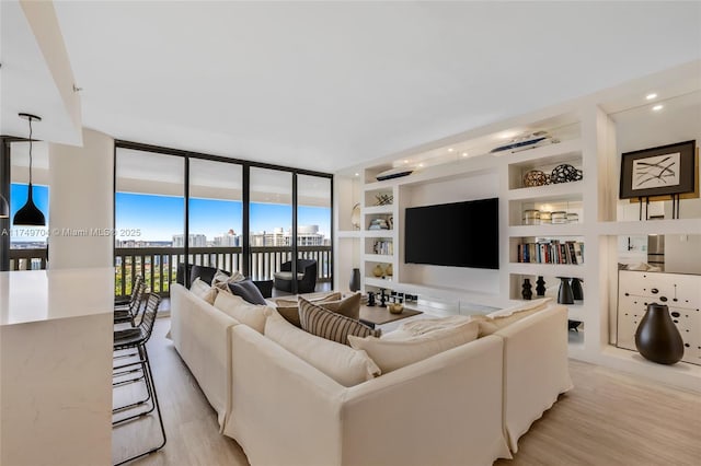 2000 Island Blvd Unit 3010, Aventura, FL 33160 - living area featuring light wood-style floors, a wall of windows, built in shelves, and recessed lighting