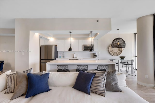 2000 Island Blvd Unit 3010, Aventura, FL 33160 - living room with a raised ceiling and light wood-type flooring