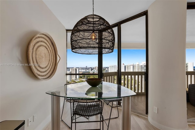 2000 Island Blvd Unit 3010, Aventura, FL 33160 - dining area with wood finished floors and a city view