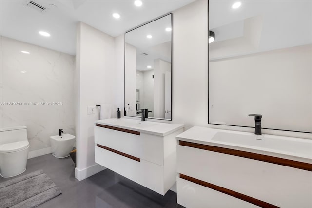 full bath featuring recessed lighting, visible vents, a sink, and a bidet