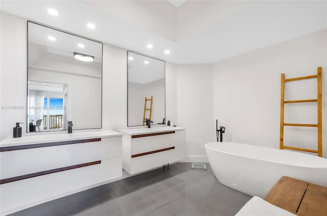 2000 Island Blvd Unit 3010, Aventura, FL 33160 - bathroom featuring recessed lighting, two vanities, a freestanding bath, and finished concrete flooring