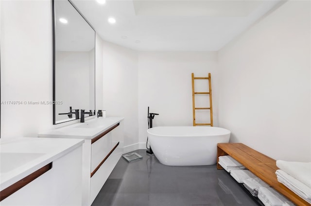 2000 Island Blvd Unit 3010, Aventura, FL 33160 - bathroom featuring two vanities, recessed lighting, a freestanding bath, and concrete flooring