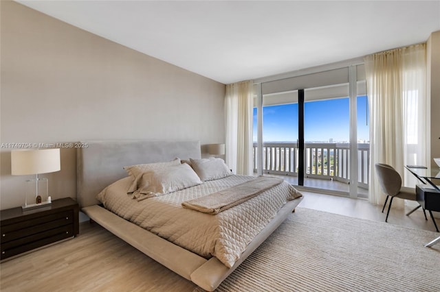 2000 Island Blvd Unit 3010, Aventura, FL 33160 - bedroom featuring a wall of windows, access to outside, and wood finished floors