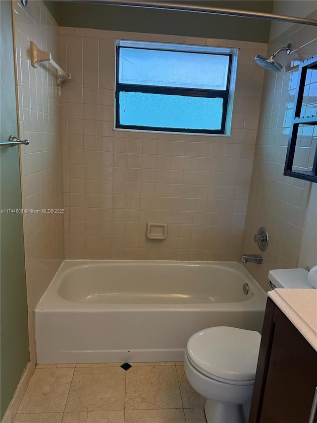 bathroom featuring shower / bathtub combination, vanity, toilet, and tile patterned floors