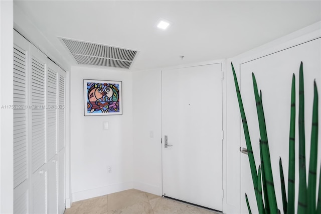 unfurnished bedroom featuring visible vents, baseboards, and light tile patterned floors