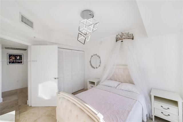 bedroom featuring visible vents and a closet