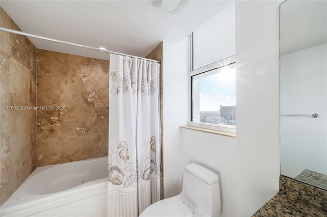 bathroom with toilet and shower / bath combo with shower curtain