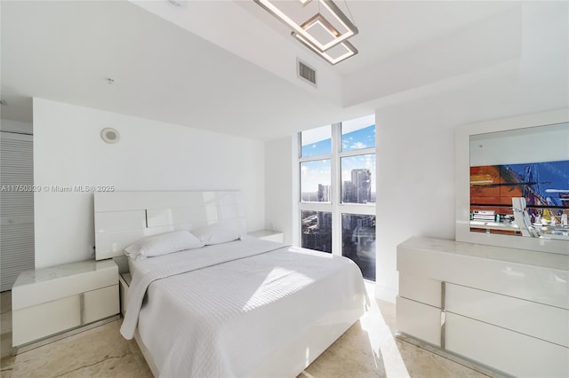 bedroom featuring visible vents