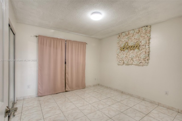 empty room with a textured ceiling