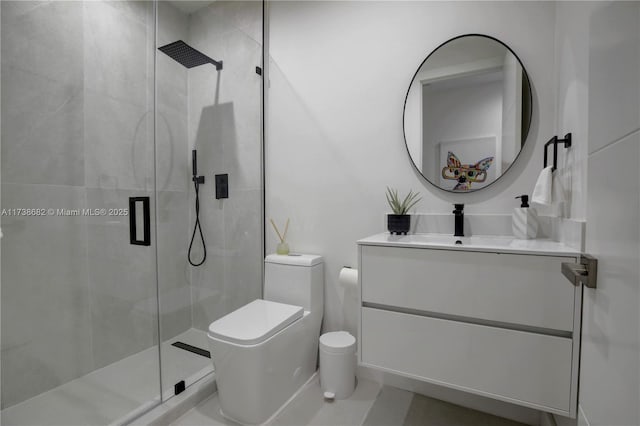 full bathroom featuring a stall shower, vanity, and toilet