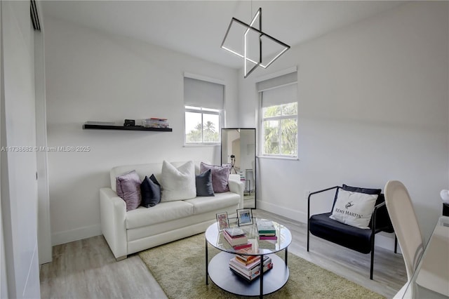 living room with light wood-style floors and baseboards