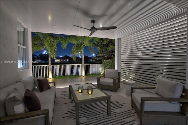 view of patio / terrace featuring fence, outdoor lounge area, and a ceiling fan