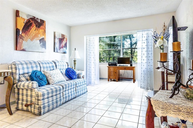 living area with light tile patterned floors and a textured ceiling