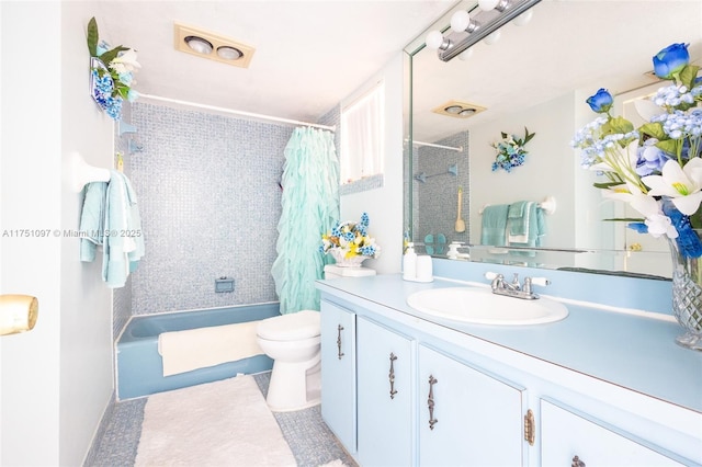 bathroom featuring shower / bath combo, vanity, and toilet