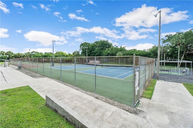 view of sport court with fence