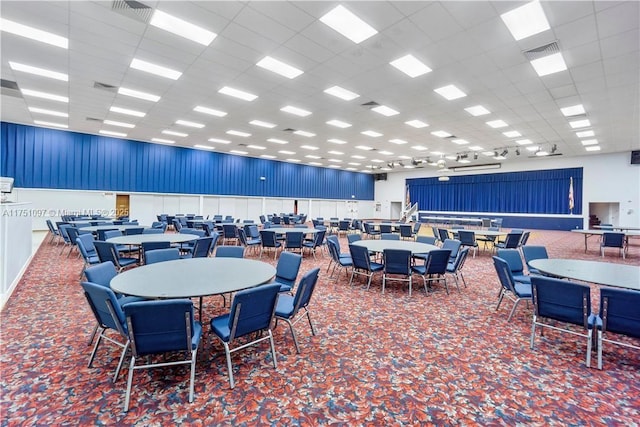 dining room featuring visible vents and a drop ceiling