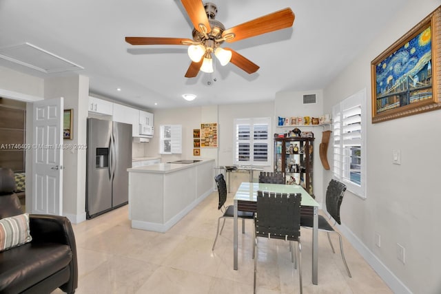 dining area with visible vents, ceiling fan, baseboards, and light tile patterned flooring