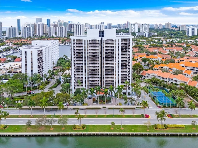 drone / aerial view featuring a water view and a city view