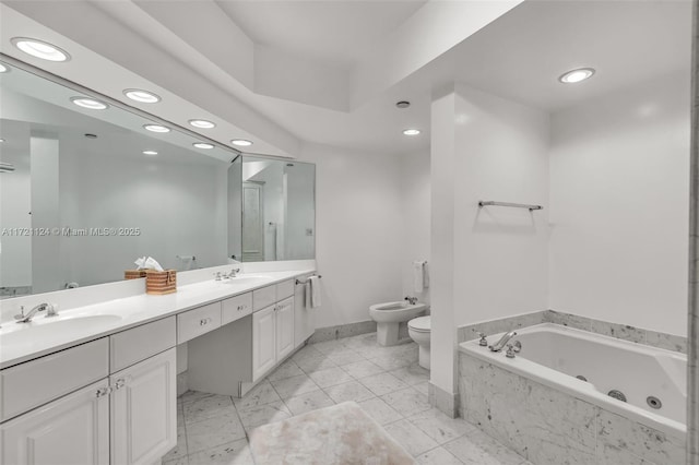 full bathroom featuring double vanity, a sink, a bidet, and a jetted tub