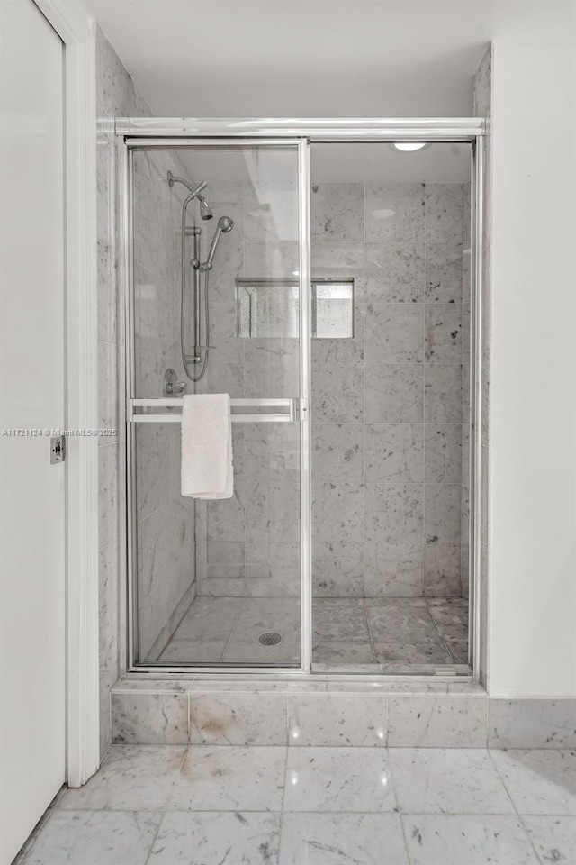 full bathroom featuring a shower stall