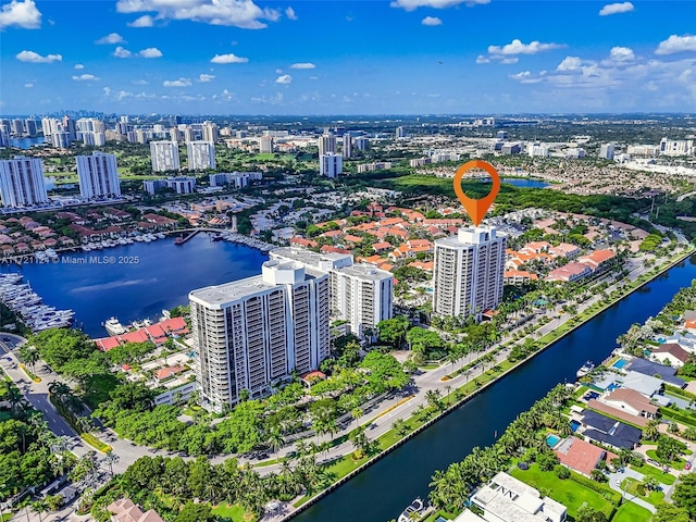 aerial view with a view of city and a water view